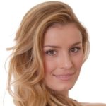 A head shot of a woman with blonde hair and brown eyes. Her eye bags are barely visible, which can be expected after puffy eye treatment.